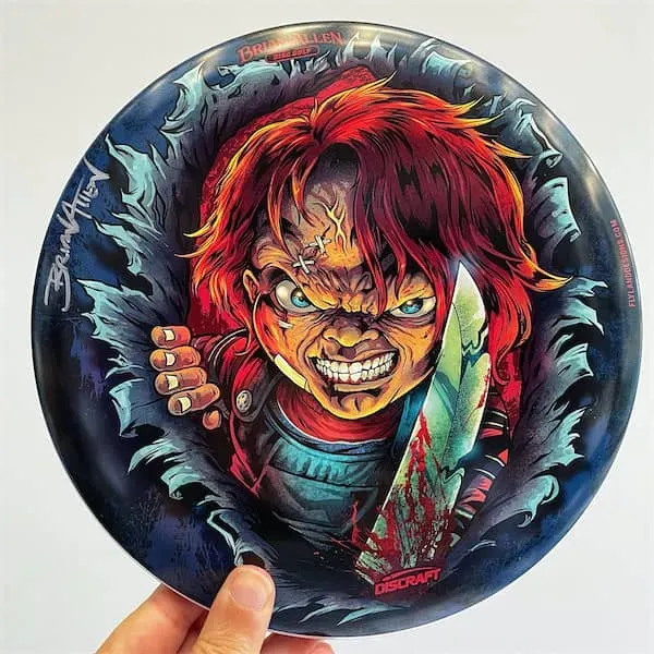FlylLand Designs Chucky Tribute Buzzz discgolfdisc SuperColor signerad